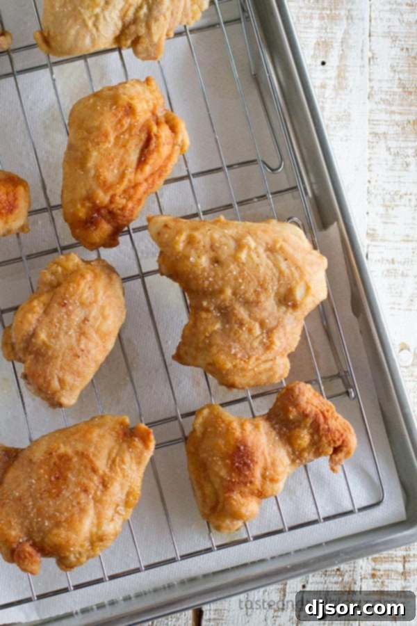 Georgia Peanut Fried Chicken: A Mad Delicious Deep Dive 5 Chicken thighs are coated in a thin powdered peanut butter and flour coating in this Georgia Peanut Fried Chicken that is not your typical fried chicken recipe!