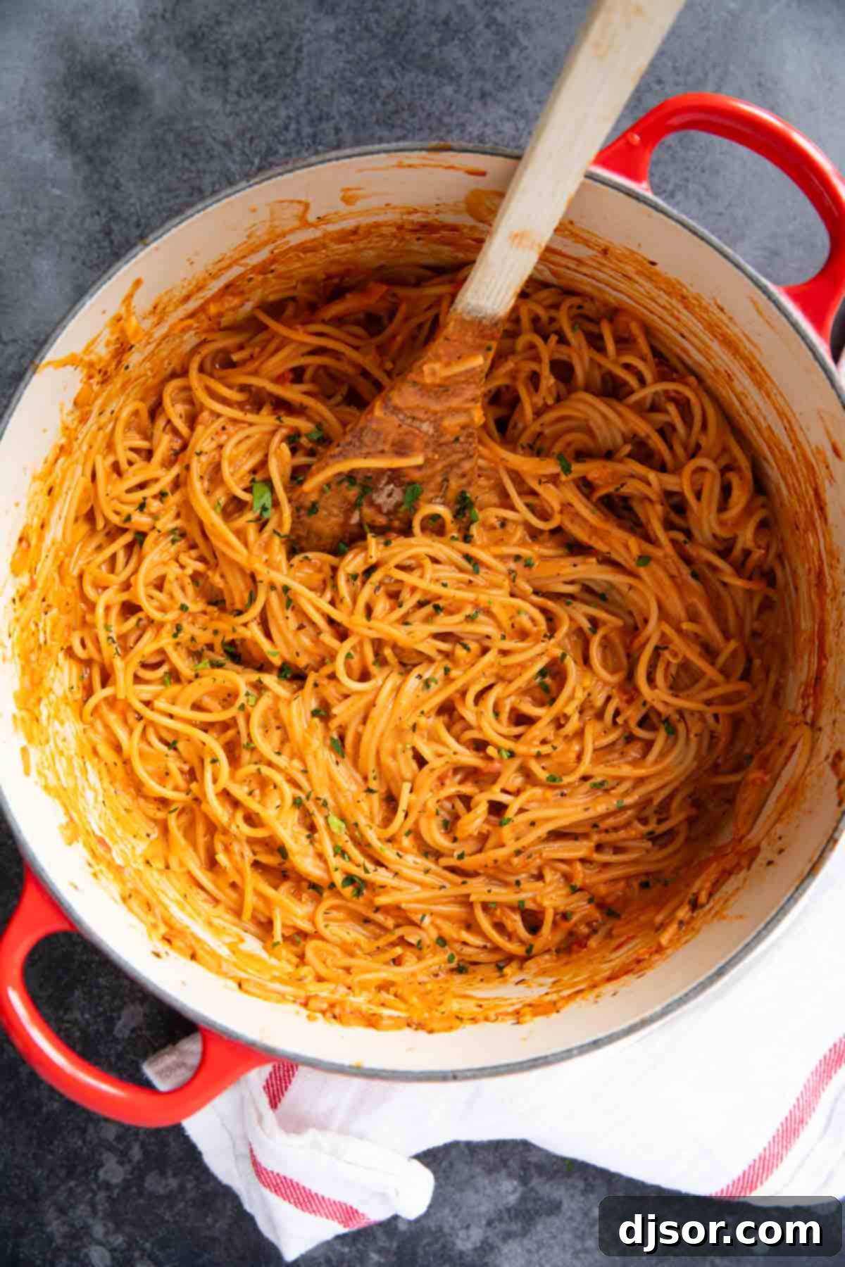 One Pan Creamy Meatball Spaghetti 6 Creamy one pot spaghetti cooked in a large red Dutch oven, ready to be served.