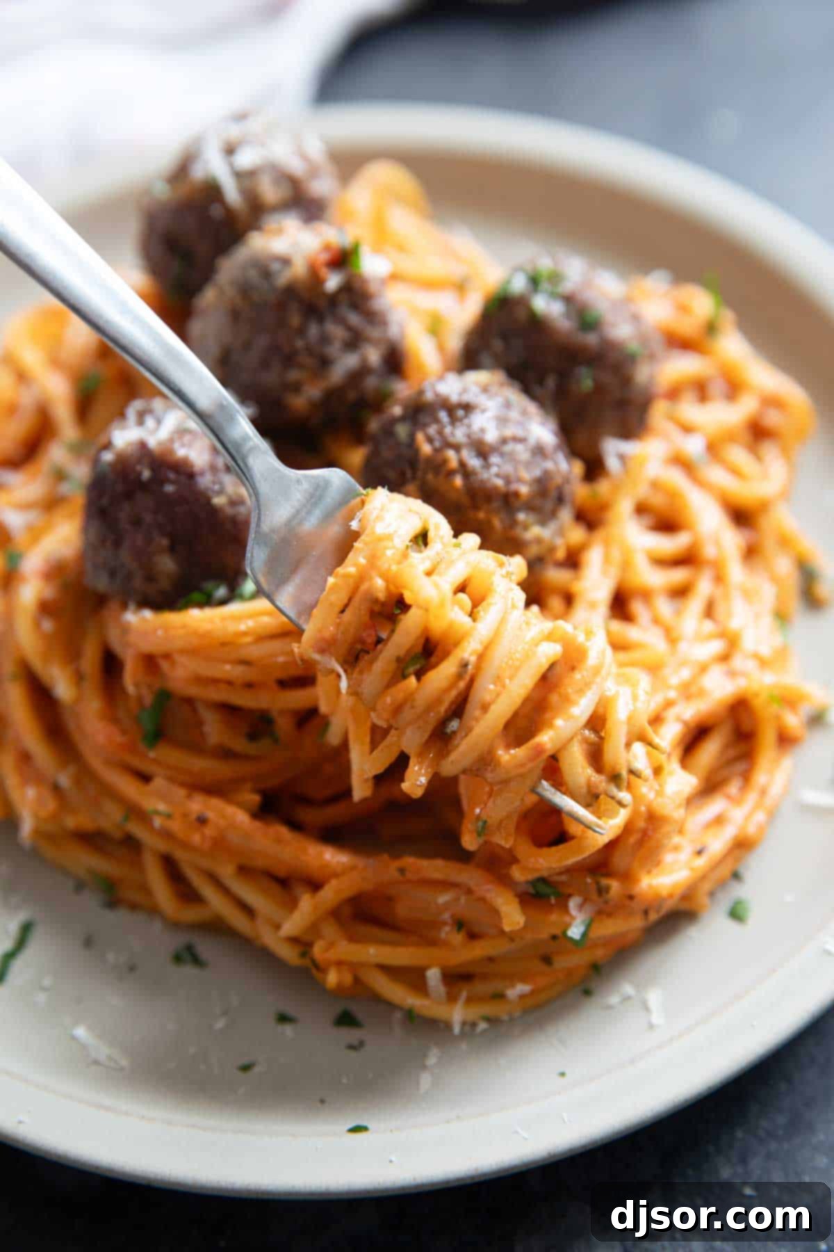 One Pan Creamy Meatball Spaghetti 8 A fork twisting creamy one pot spaghetti, showcasing its texture and sauce.