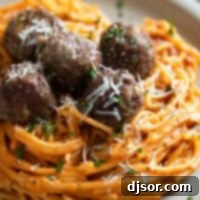 One Pan Creamy Meatball Spaghetti 9 Creamy One Pot Spaghetti topped with baked meatballs, parsley, and parmesan cheese.