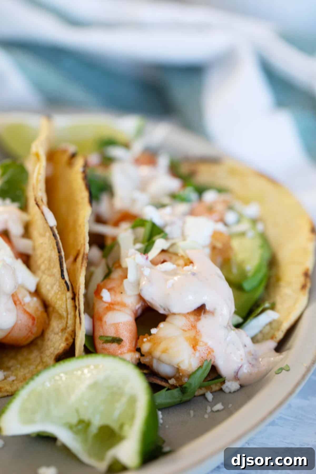 Tacos with shrimp and a chipotle lime crema on top.
