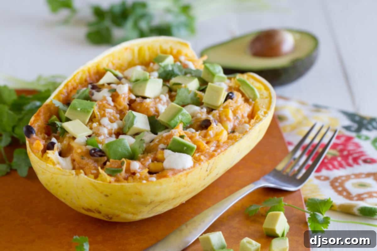 Vibrant Southwestern Stuffed Spaghetti Squash, filled with colorful beans, corn, and melted cheese, ready for a healthy meal.