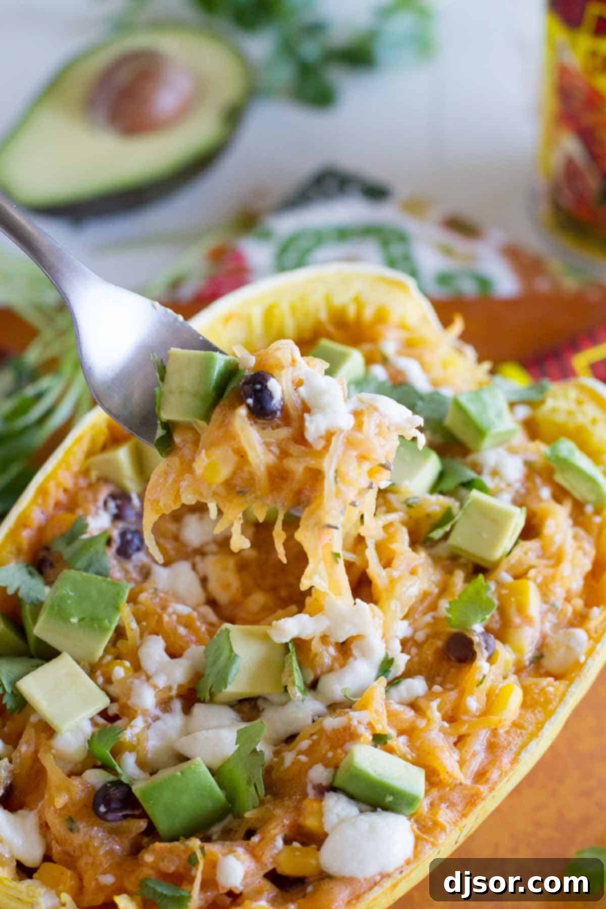 A forkful of delicious Southwestern Stuffed Spaghetti Squash, showcasing the well-combined ingredients and appetizing texture.