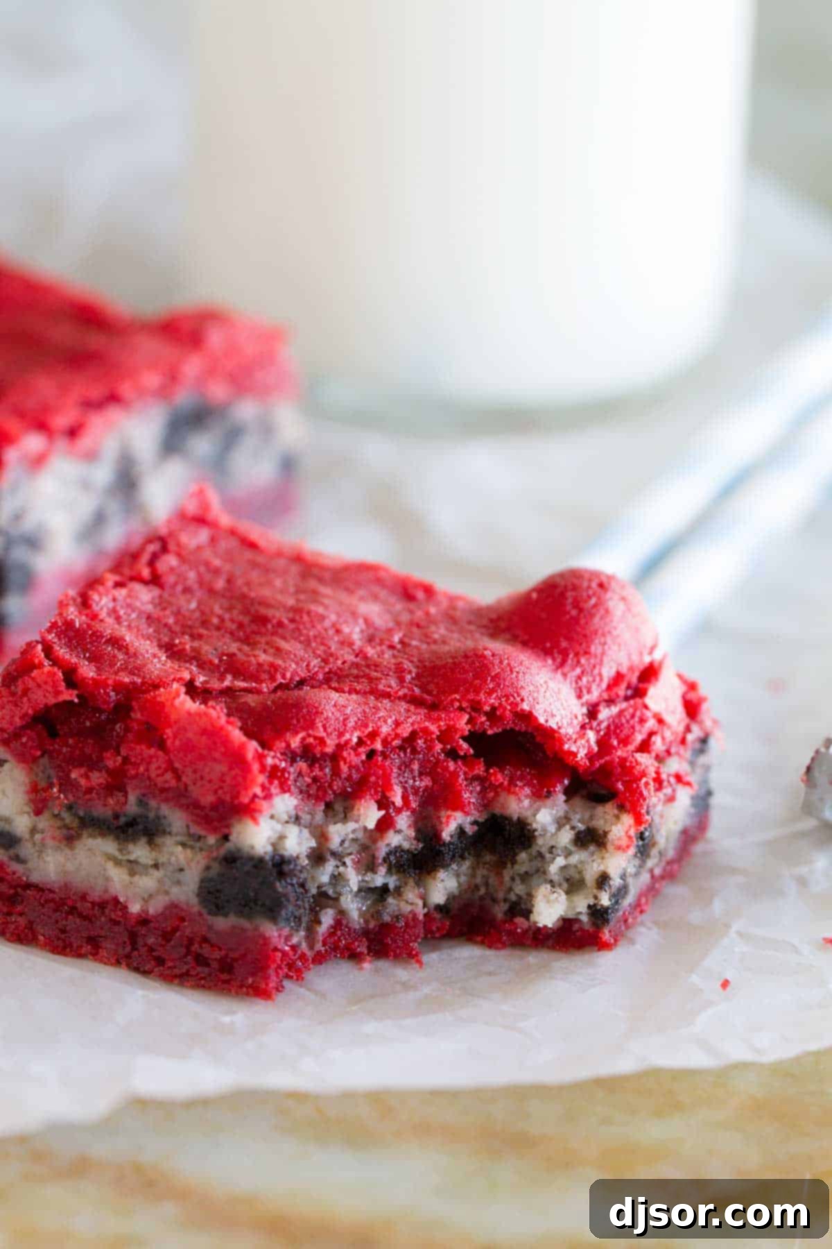 Decadent Oreo Cream Cheese Stuffed Red Velvet Brownies 5 Oreo Cream Cheese Stuffed Red Velvet Brownie with a bite taken from it.
