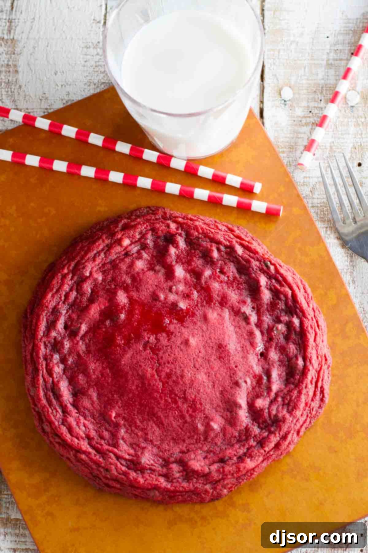Overhead view of an XL Red Velvet Cookie, highlighting its perfectly round shape and inviting texture.