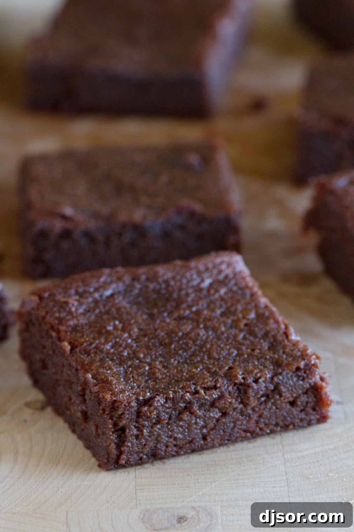 Fudgy Coconut Flour Brownies 3 Close-up of a rich, chocolate brownie made with coconut flour, emphasizing its dense and fudgy texture.