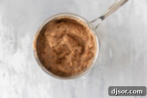 Refried beans in a pan.