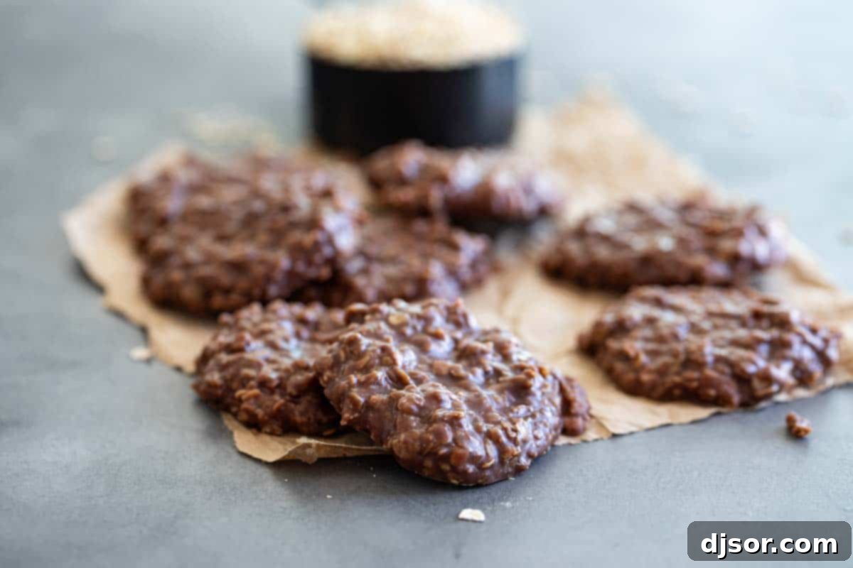 A stack of delicious chocolate no bake cookies on brown parchment paper, ready to be enjoyed.
