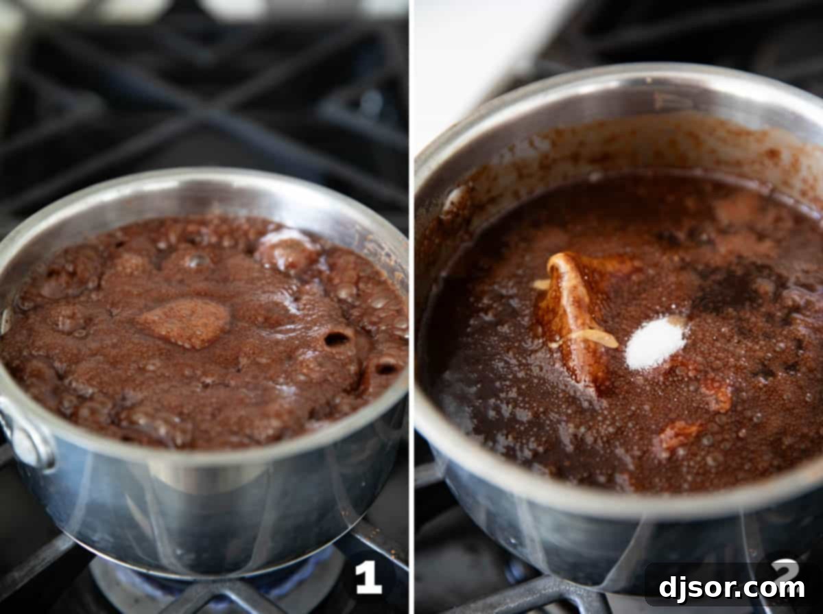 A saucepan filled with the rich, bubbling chocolate peanut butter mixture for no bake cookies on a stove.