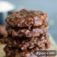 A stack of perfectly set chocolate peanut butter no bake cookies.