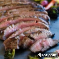 Grilled Balsamic Flank Steak 2 full sliced flank steak on a baking sheet
