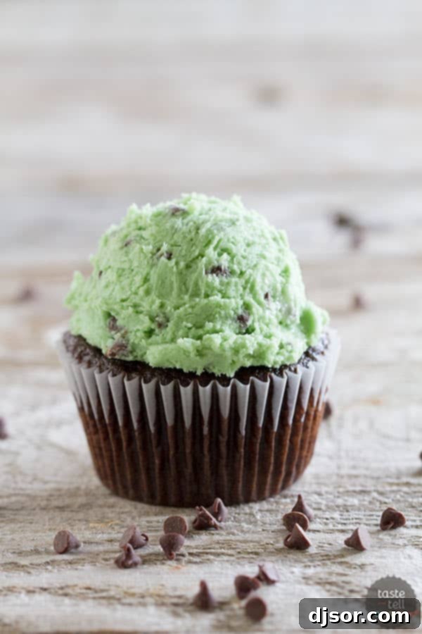 Decadent Mint Chocolate Chip Cookie Dough Frosting 4 Close-up of Mint Chocolate Chip Cookie Dough Frosting on a cupcake.