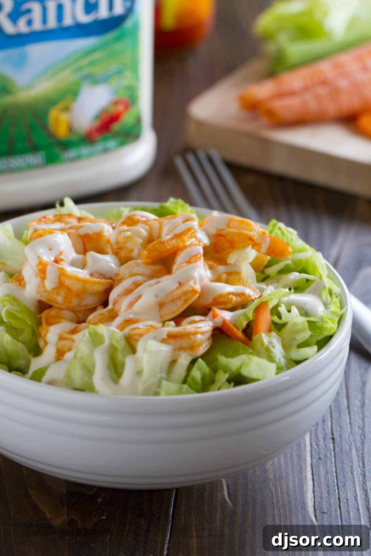 Spicy Buffalo Ranch Shrimp Salad 2 A beautifully arranged Buffalo Ranch Shrimp Salad, featuring succulent buffalo shrimp atop a bed of fresh greens, drizzled with creamy ranch dressing. Ideal for a fast and flavorful lunch.