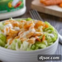 Buffalo Ranch Shrimp Salad topped with easy buffalo shrimp.