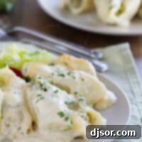 Creamy Chicken Alfredo Shells Bake 2 plate with a serving of chicken alfredo stuffed shells