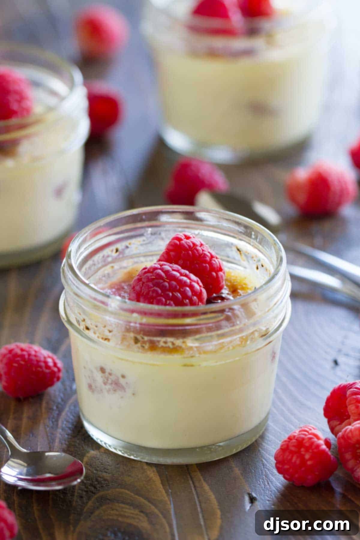 Heavenly Raspberry Creme Brulee 2 Raspberry Creme Brûlée topped with fresh raspberries in a jar.