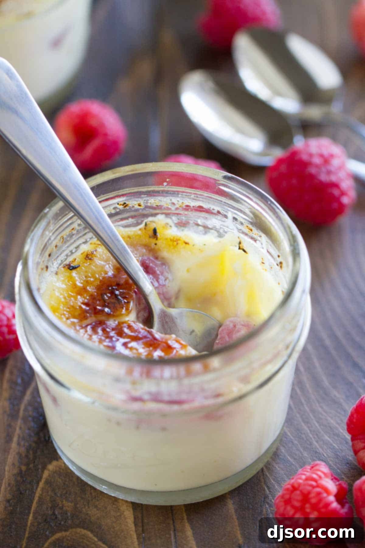 Heavenly Raspberry Creme Brulee 4 Raspberry Creme Brûlée with a bite taken from it.