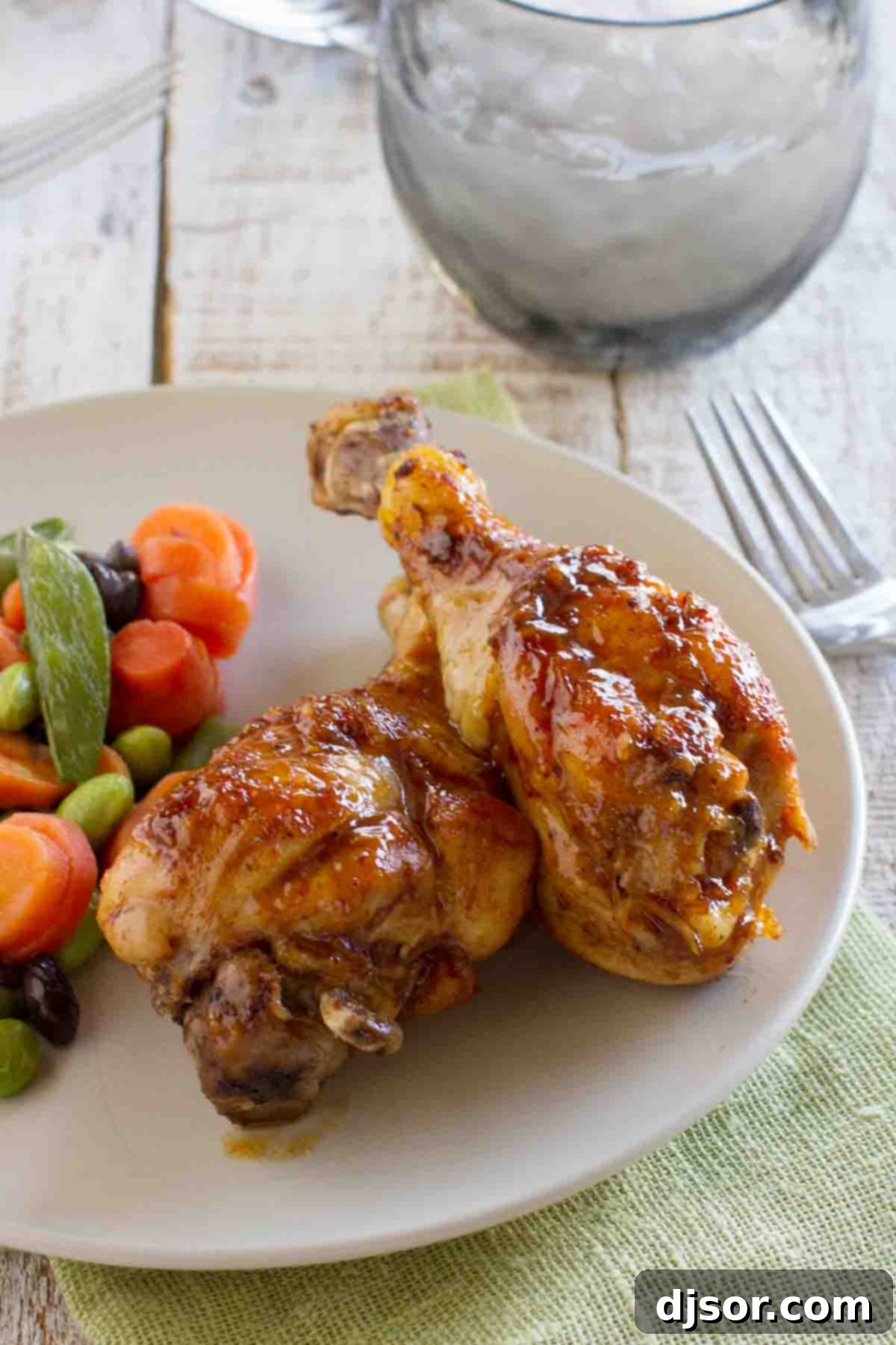 Sticky and sweet, these Honey Balsamic Drumsticks will be a meal that the whole family will devour! Plus a review of 400 Calories or Less with Our Best Bites. A generous serving of Honey Balsamic Chicken Drumsticks, served with fresh green beans and roasted potatoes, creating a complete and delicious meal.