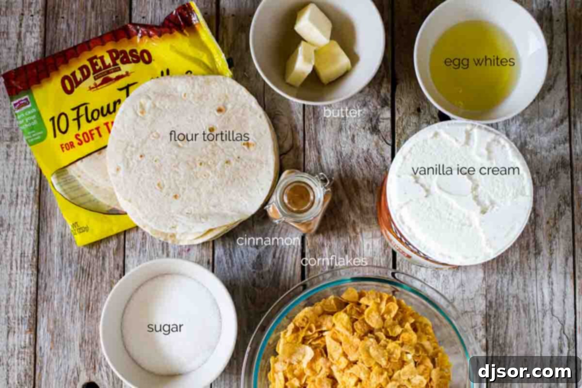 Collection of ingredients laid out on a table, including vanilla ice cream, cornflakes, cinnamon, egg whites, flour tortillas, butter, sugar, and various toppings, ready for making homemade fried ice cream with cinnamon sugar tortilla bowls.