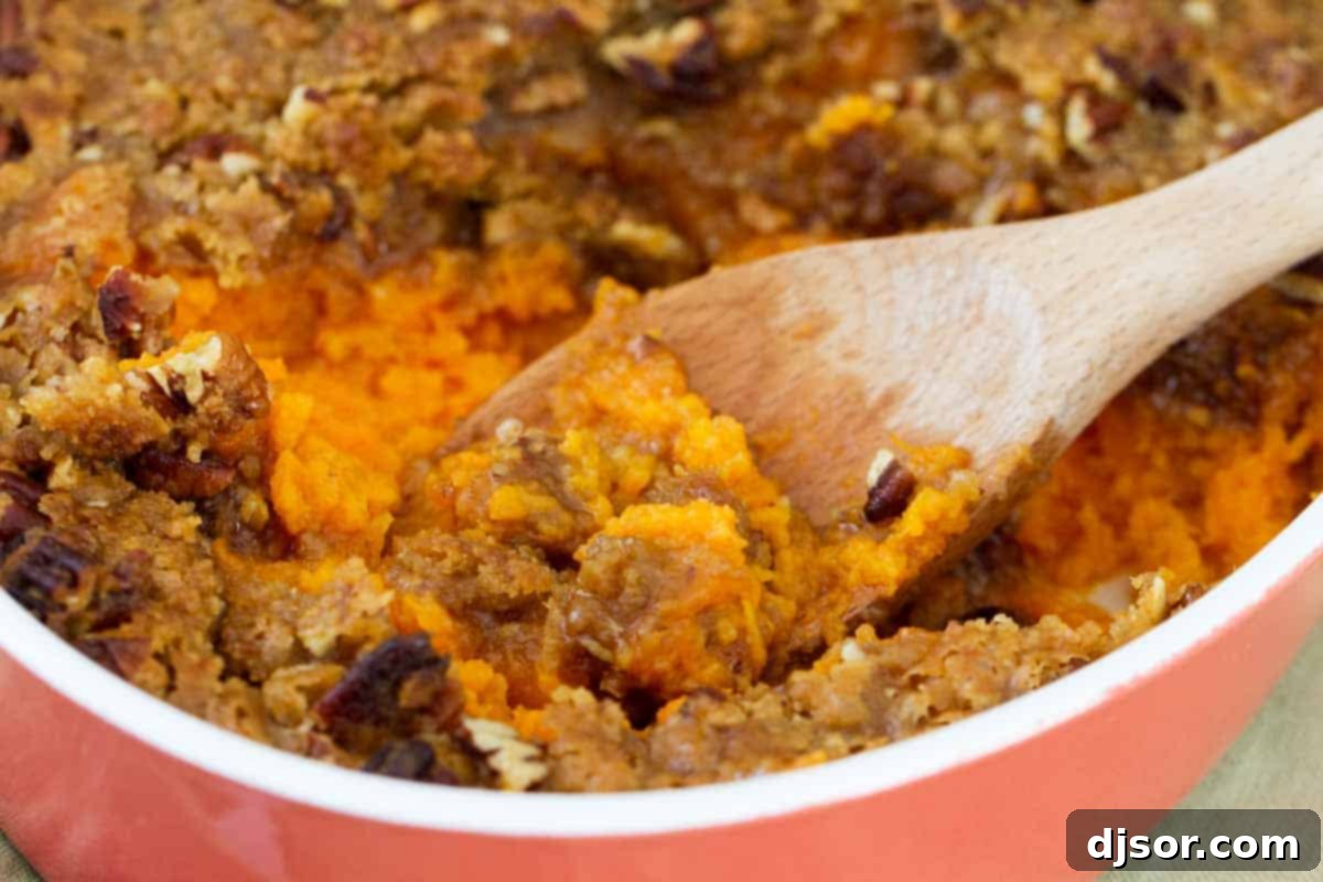 The Best Sweet Potato Casserole, perfect for any holiday feast Golden brown sweet potato casserole in a baking dish, ready to be served for Thanksgiving or Christmas