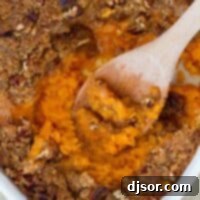 Ultimate Sweet Potato Casserole 2 overhead view of sweet potato casserole with wooden spoon