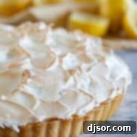 Full French Lemon Cream Tart topped with meringue.