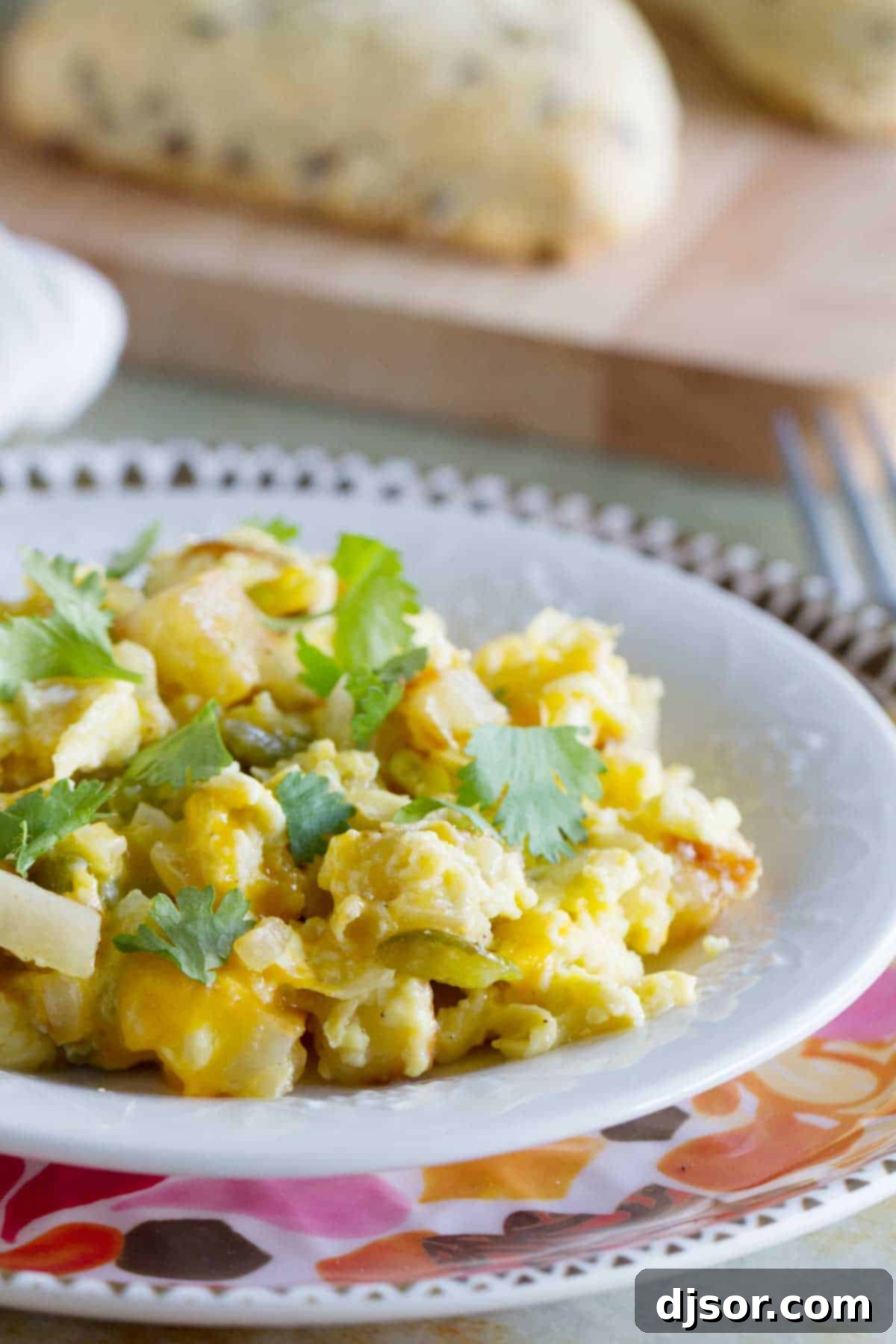 Plate with Poblano Chile Scramble - a hearty egg and potato dish infused with roasted chile peppers, showcasing a perfect breakfast for dinner.