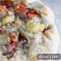 Rustic Roasted Vegetable Galette 4 A great way to clear out the vegetable bin in your refrigerator, this Crostata with Oven Roasted Vegetables is a filling vegetarian recipe that is packed with flavor.