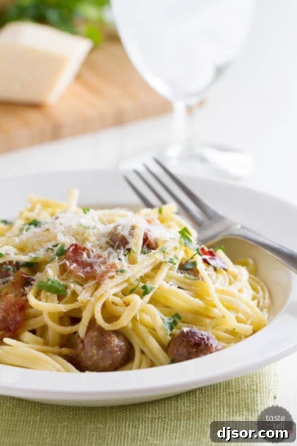 Savory Sausage Carbonara 2 A hearty bowl of creamy Sausage Carbonara Pasta with parsley garnish, ready to be served.