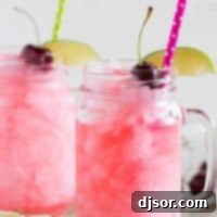 How to Make a Homemade Slurpee 5 homemade slurpees in glasses with lime slices, cherries and straws