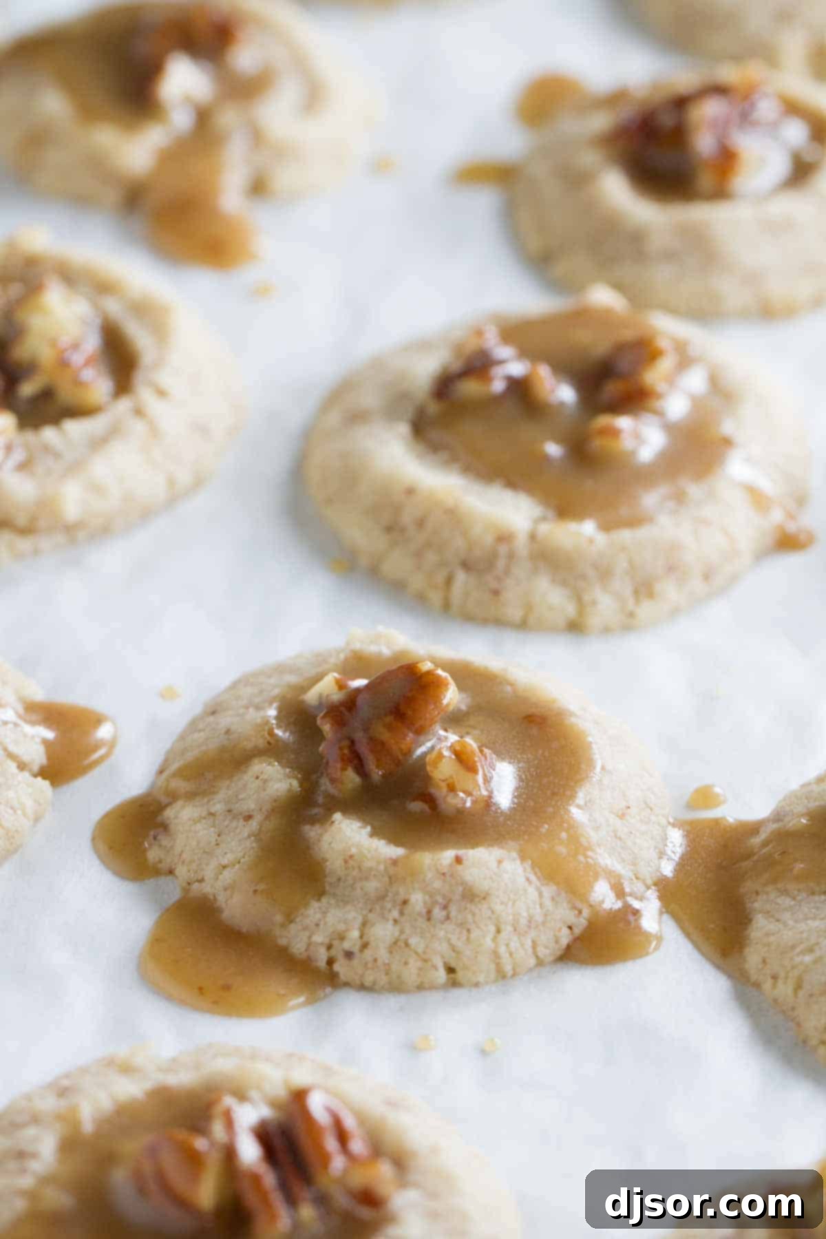 adding filling to pecan praline thumbprints