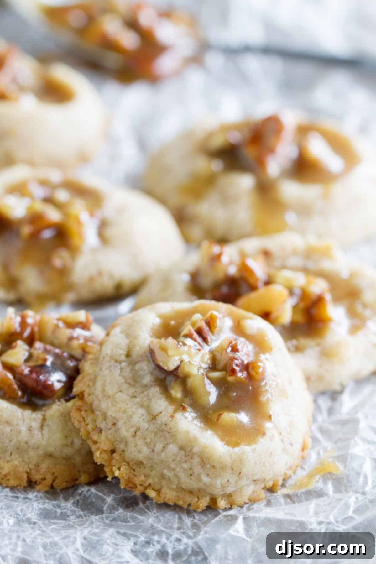 Pecan Praline Thumbprint cookies stacked on each other
