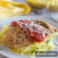 Golden Baked Chicken Parmesan 4 Baked Chicken Parmesan with tomato sauce and herbs.
