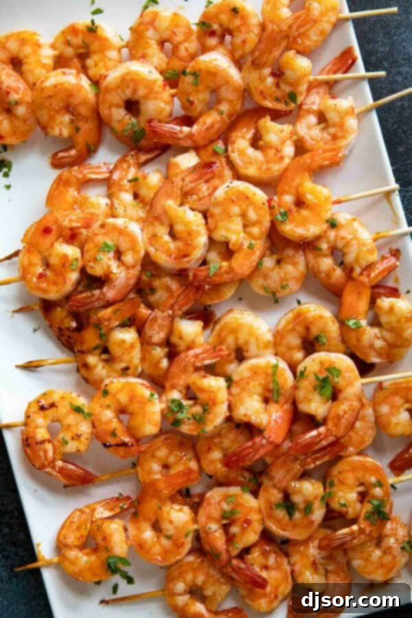 Shrimp kabobs coated with a chili honey garlic sauce.