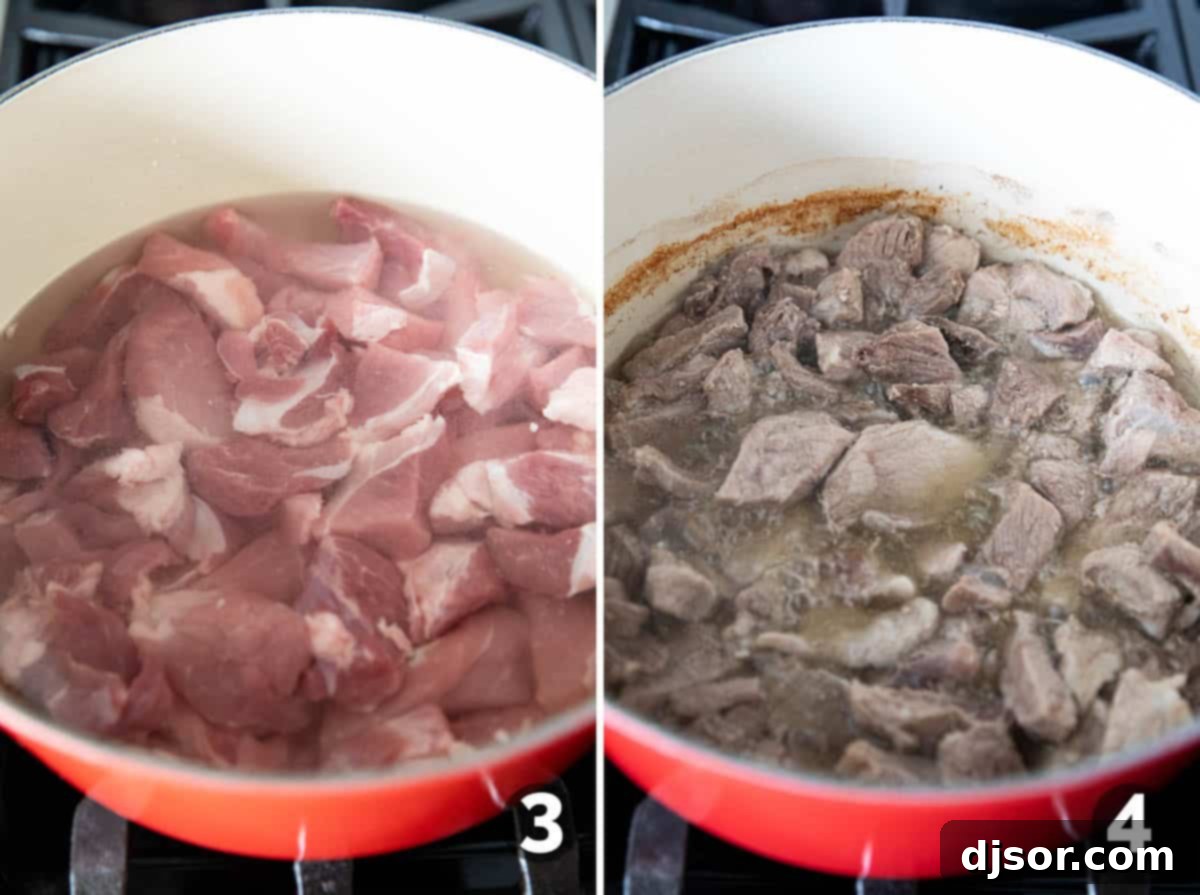 Slow-Roasted Crispy Pork Perfection 5 Pork pieces simmering in water in a Dutch oven for Pork Carnitas.