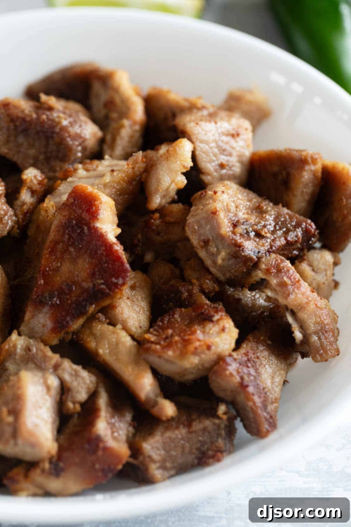 Slow-Roasted Crispy Pork Perfection 8 Close-up of golden, crispy pieces of Pork Carnitas, showing the perfect texture.