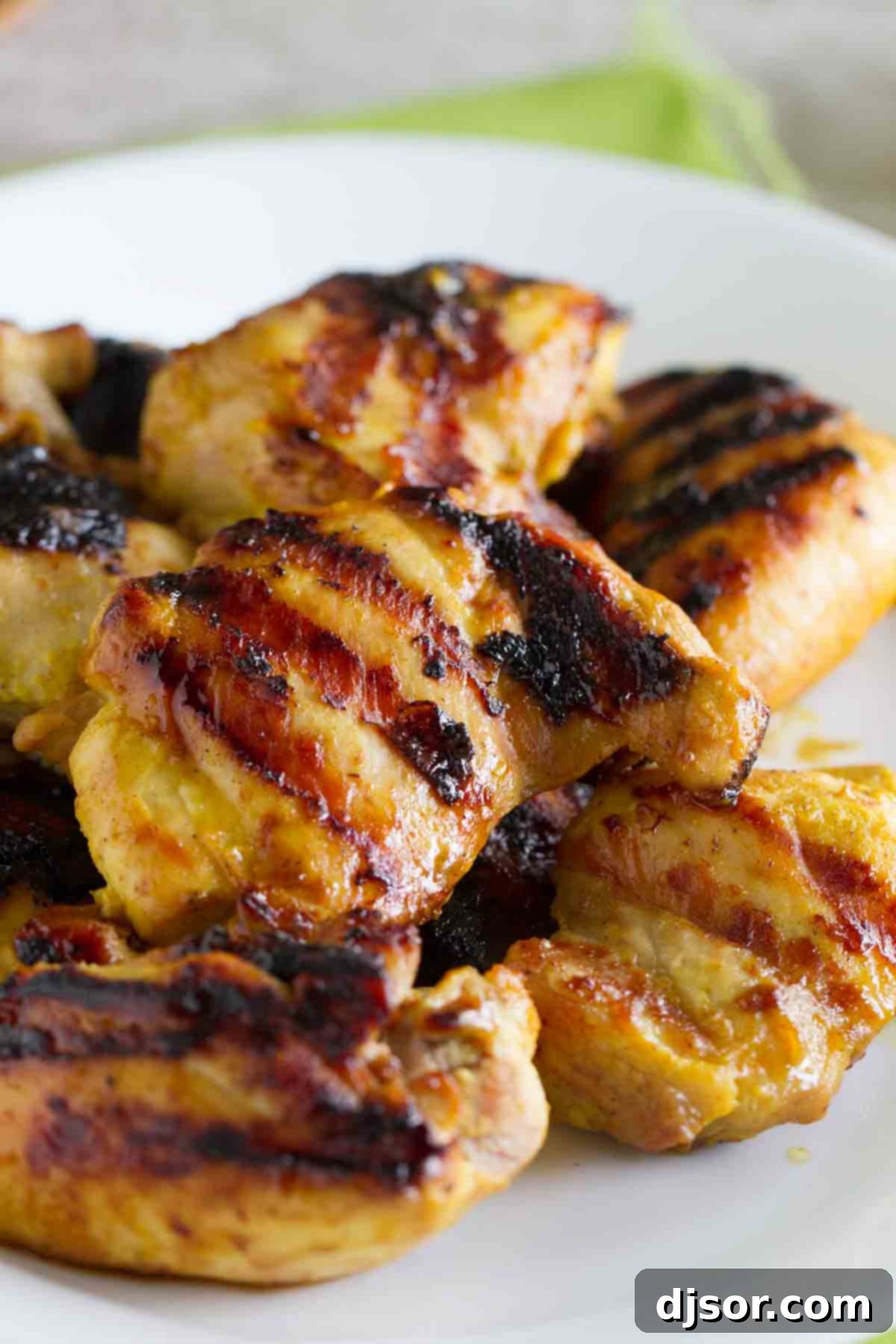 Close-up of Grilled Brown Sugar Mustard Chicken, showing perfect grill marks and the glossy, caramelized sauce.
