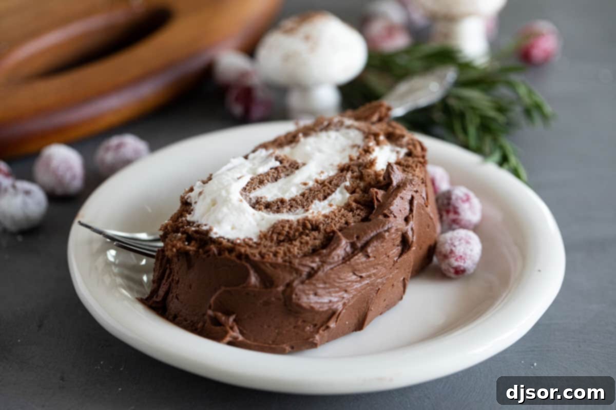 Slice of Bûche de Noël on a plate.
