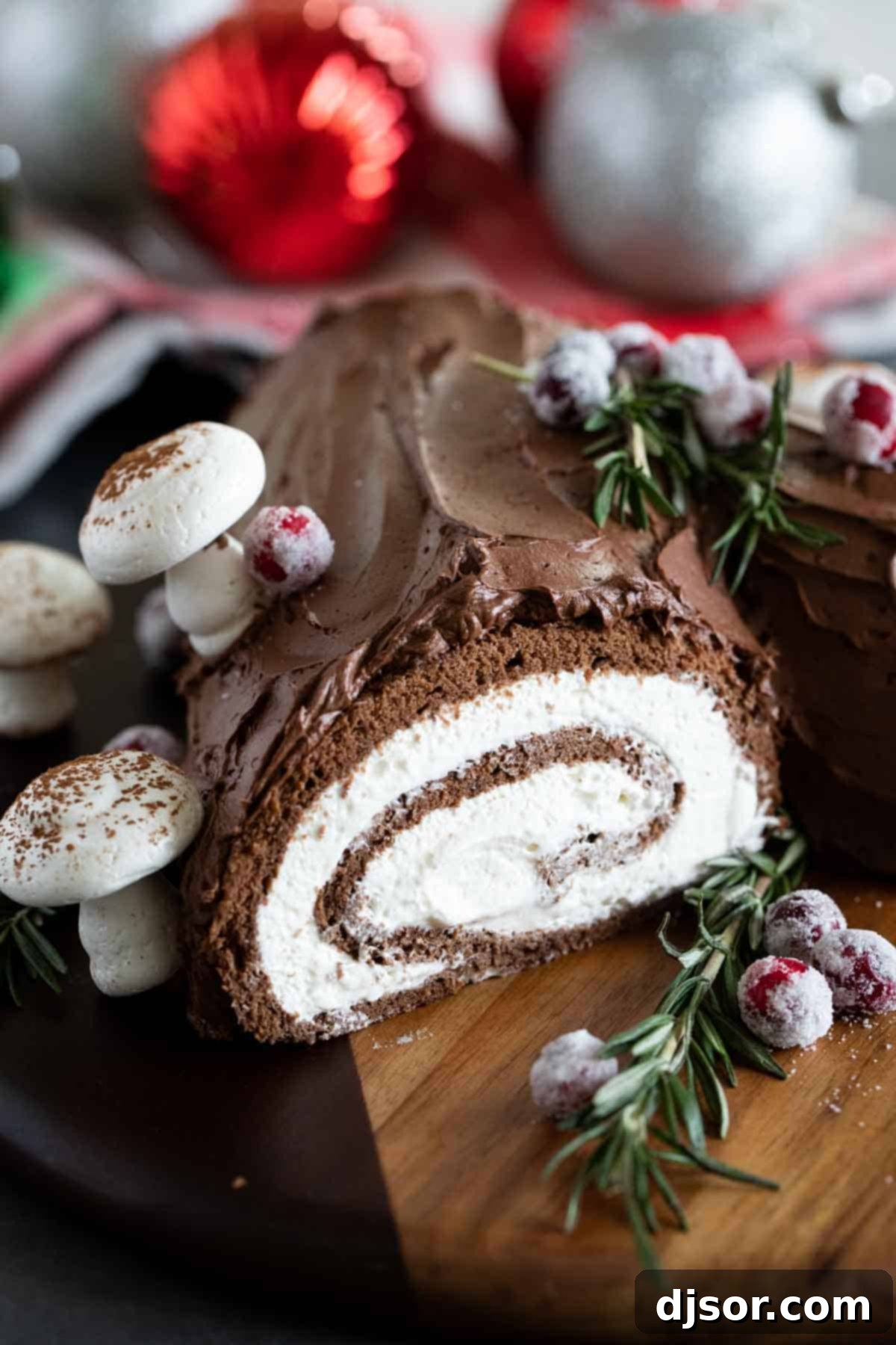 Bûche de Noël (Yule Log Cake) decorated with whipped chocolate ganache.