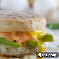 Perfect for breakfast, lunch or dinner, this Sausage and Egg Breakfast Sandwich Recipe has a homemade sausage patty and a perfectly cooked egg, and then is topped with an easy Sriracha Cilantro Mayonnaise.