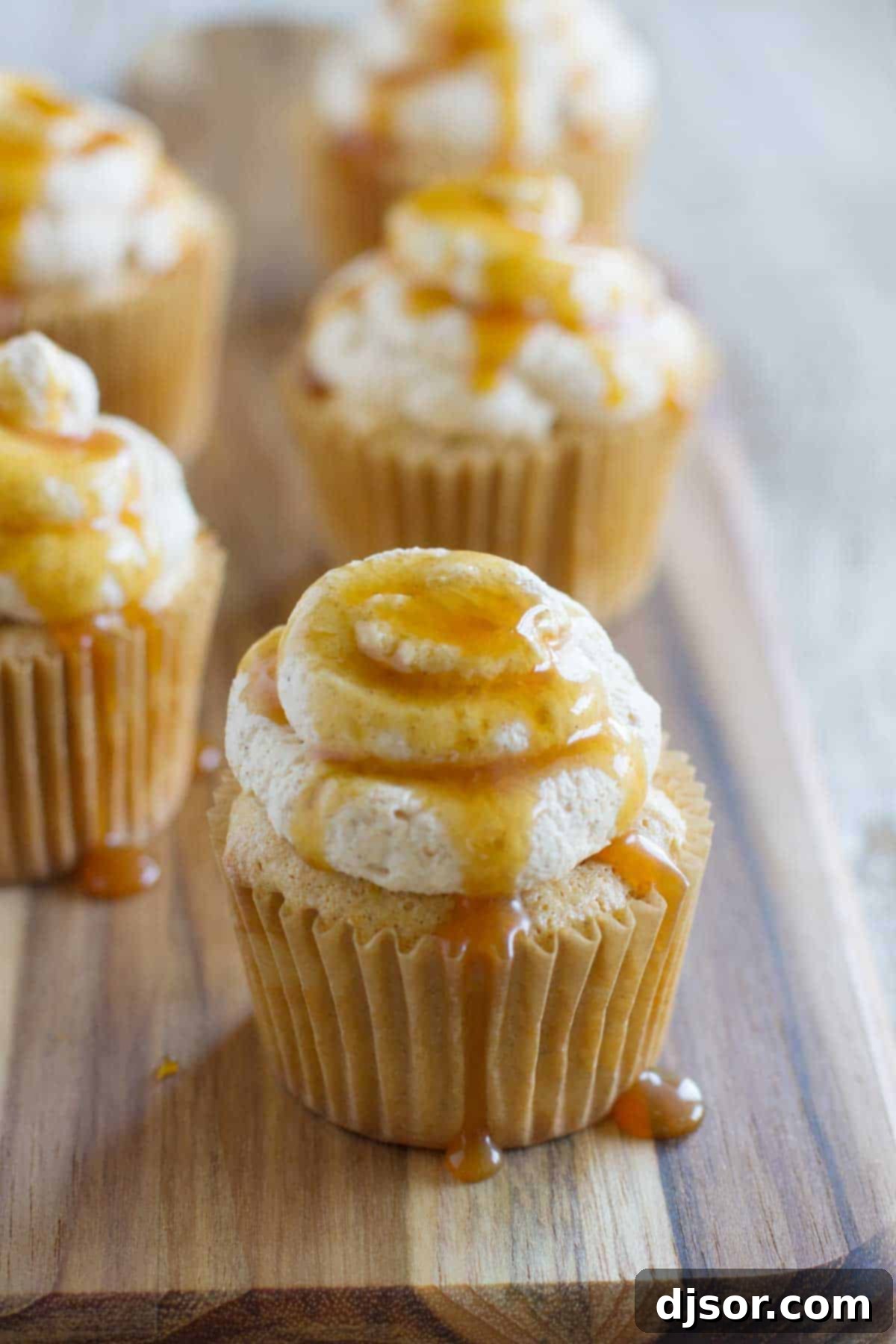 Pumpkin Cloud Cupcakes 2 Delightful Pumpkin Angel Food Cupcakes, elegantly topped with pumpkin spiced whipped cream and a drizzle of golden caramel sauce.