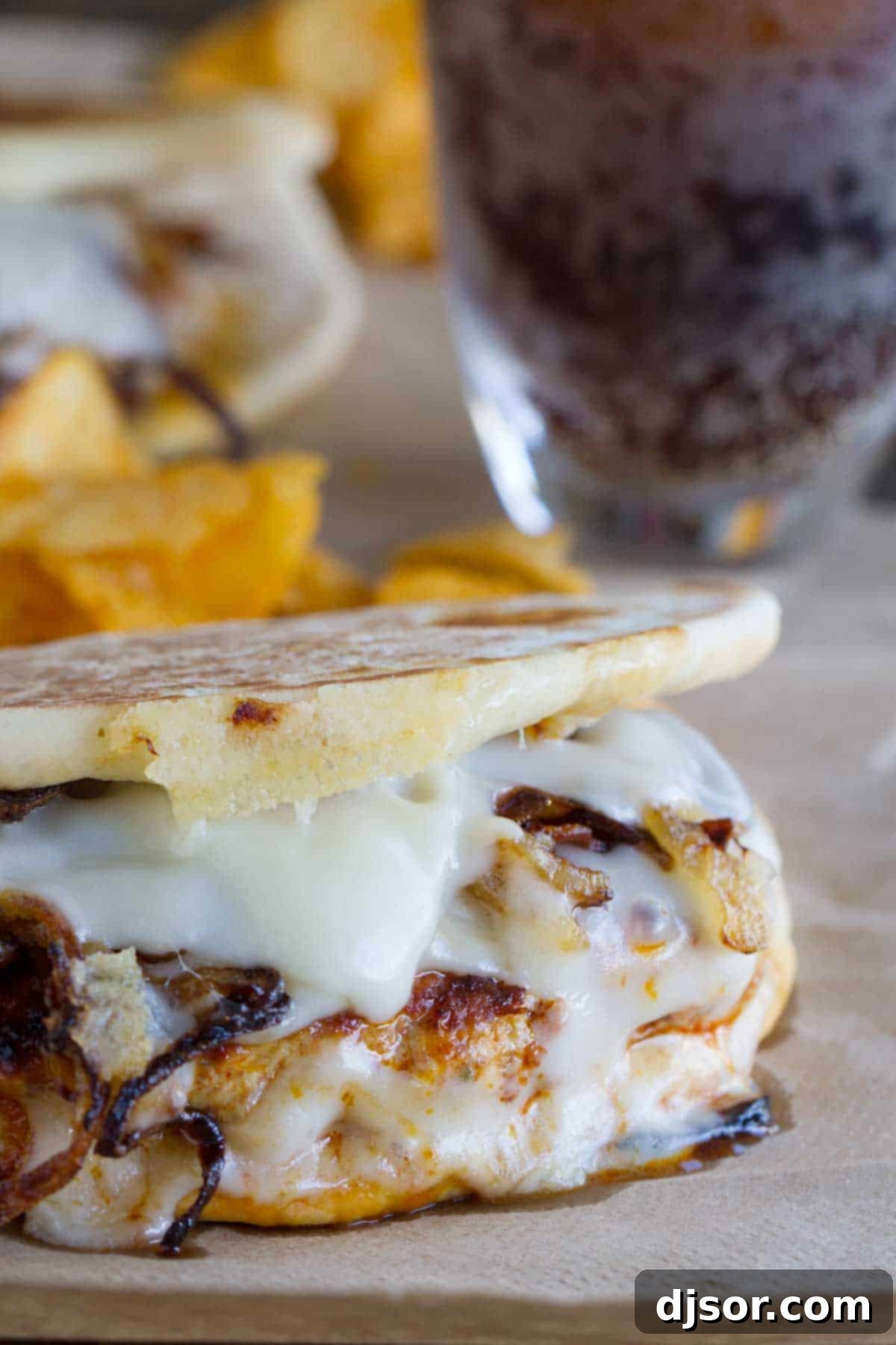 Sizzling Chorizo-Chicken Melt 2 Delicious Chicken and Chorizo Patty Melts piled high with caramelized onions and melted Swiss cheese, served on toasted flatbread.