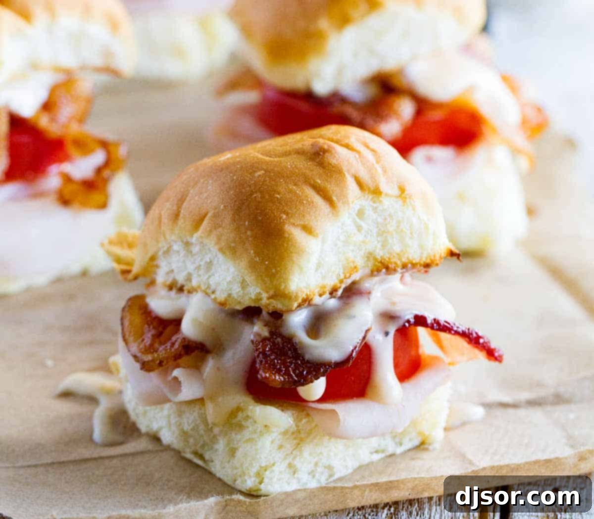 Easy Mini Kentucky Hot Brown Sandwiches made with slider rolls, perfectly browned and ready to serve.
