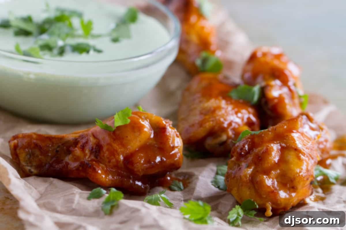 Enchilada Inspired Chicken Wings 2 Enchilada Chicken Wings with cilantro and cilantro dipping sauce.