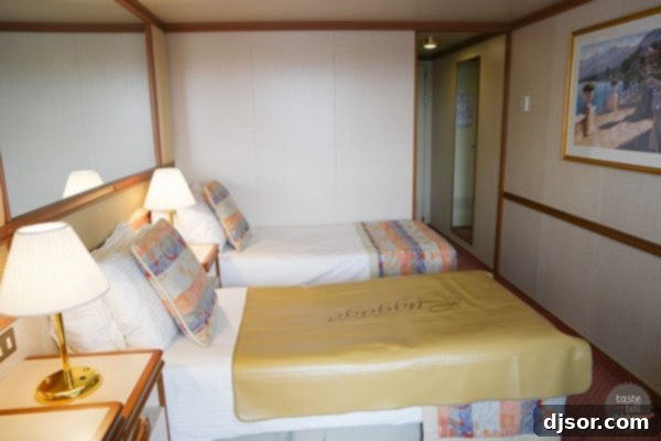 Ruby Princess Royal Voyage 4 Interior view of a Ruby Princess lounge or common area, featuring elegant decor and comfortable seating.