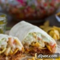 Frito Crunch Chili Burrito 6 A Frito Pie Burrito with chili, Fritos, pico de gallo, and green chile queso.