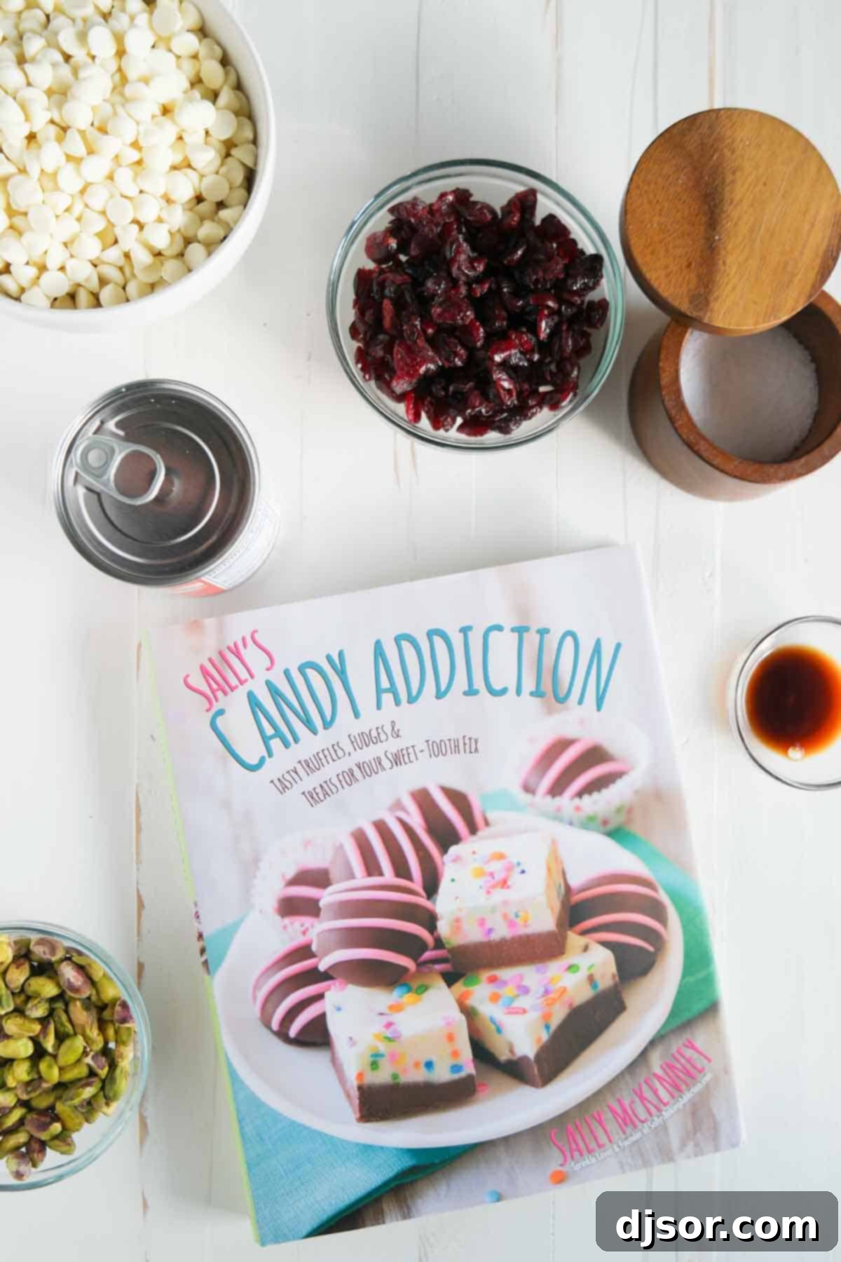 Ingredients for cranberry pistachio fudge, plus a copy of Sally's Candy Addiction cookbook.