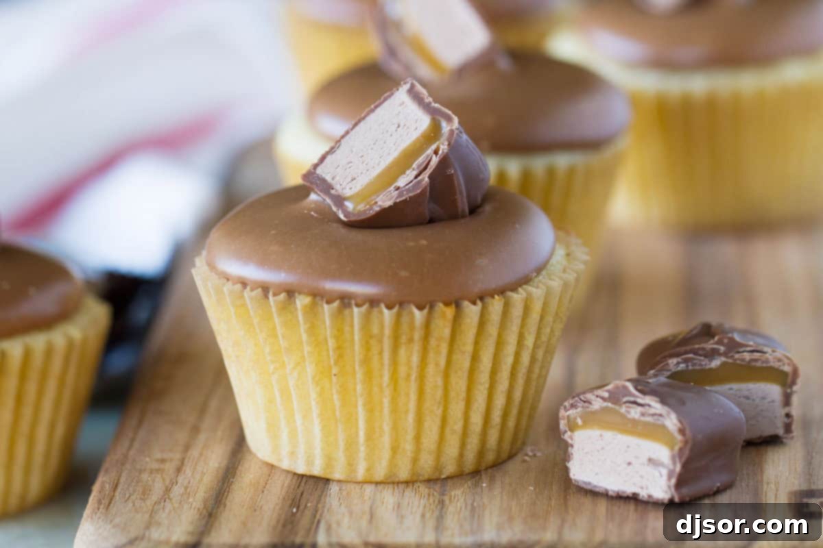 Milky Way Cupcakes - white cupcakes topped with frosting made from Milky Way candy bars.