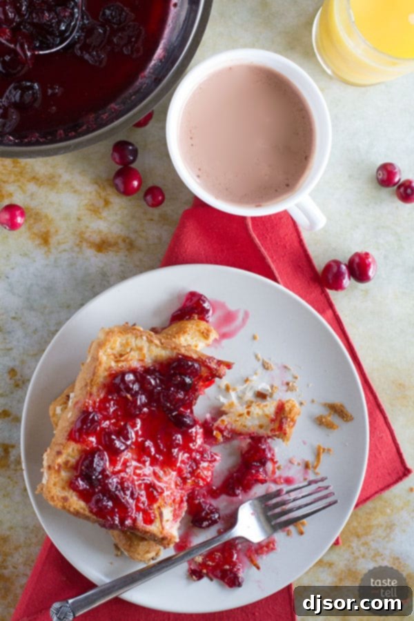 Perfectly baked Coconut Crusted French Toast slices arranged on a platter, ready to be served with the homemade Cranberry Syrup.