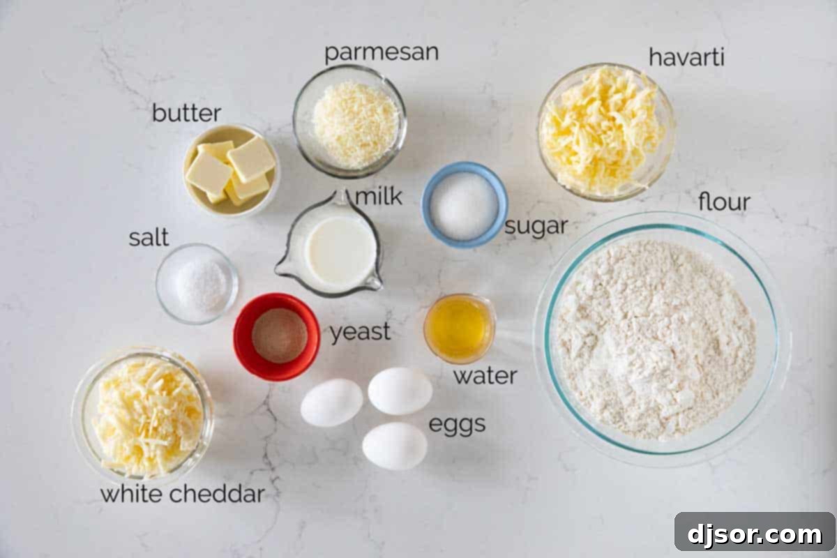 A collection of fresh ingredients laid out, ready for making cheesy crescent rolls: milk, water, sugar, yeast, flour, butter, salt, eggs, and a variety of cheeses.